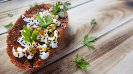 Sauce, mayonnaise ,parsley and black cumin on slice of bread