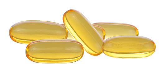 Close up of food supplement oil filled capsules suitable for: fish oil, omega 3, omega 6, omega 9,...