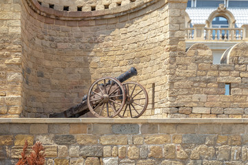 Old cast iron cannon, on the fortress wall