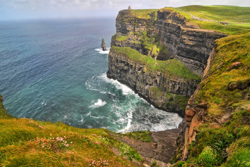The Cliffs of Moher located at the southwestern edge of the Burren region in County Clare, Ireland - obrazy, fototapety, plakaty