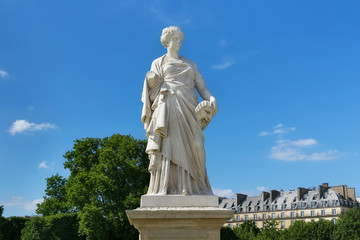 View of the marble sculpture La Comedie (1875) by Julien Toussaint Roux in the Tuileries Park, Paris, France.