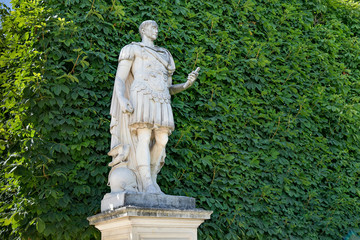 View of the marble sculpture Julius Caesar (copy of the sculpture 1694 by Ambrogio Parisi) in the Tuileries Park, Paris, France.