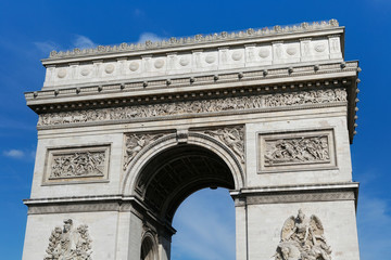 Fototapeta na wymiar View of the famous Triumphal Arch in Paris, France. The Arc de Triomphe honours those who fought and died for France in the French Revolutionary and Napoleonic Wars.