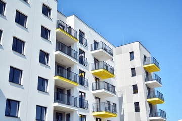 Modern apartment buildings on a sunny day with a blue sky. Facade of a modern apartment building