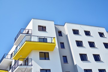 Modern apartment buildings on a sunny day with a blue sky. Facade of a modern apartment building