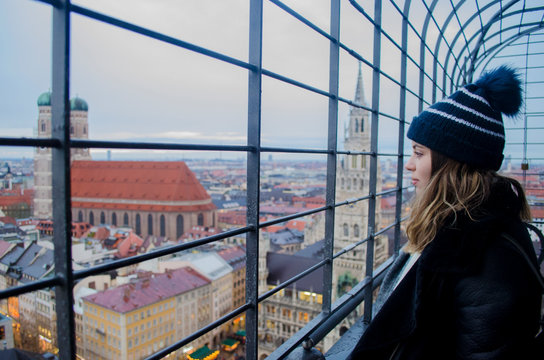 Girl on the top of a church in Munich during the winter