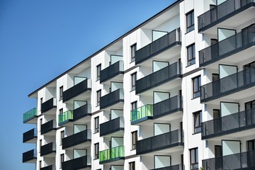 Modern apartment buildings on a sunny day with a blue sky. Facade of a modern apartment building