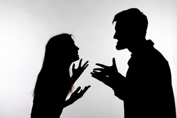 Relationship difficulties, conflict and abuse concept - man and woman face to face screaming shouting each other dispute silhouette isolated on white background - obrazy, fototapety, plakaty