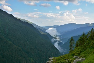 Obraz premium the fog above the mountain ridges