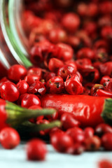 red hot bird chili pepper with pepper corns