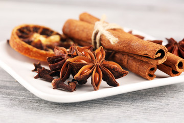 cinnamon, staranise and cloves. winter spices on wooden table