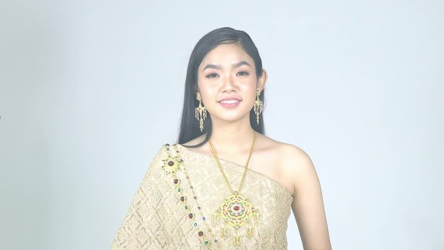 Glamorous model in a traditional Thai dress in a photo shoot