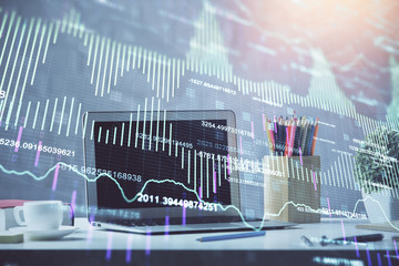 Financial market graph hologram and personal computer on background. Multi exposure. Concept of forex.