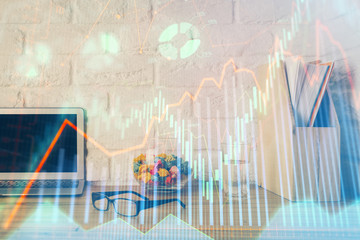 Financial chart drawing and table with computer on background. Double exposure. Concept of international markets.