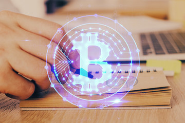 Man's hands working with notes background. Cryptocurrency and finance concept.
