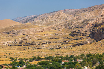 Panoramic view of mountains and stone caves of the city of Hasankeyf, Turkey, Batman Province
