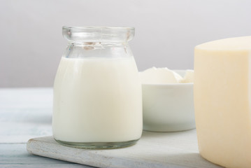 dairy products on old white wooden table