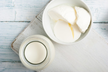 dairy products on old white wooden table