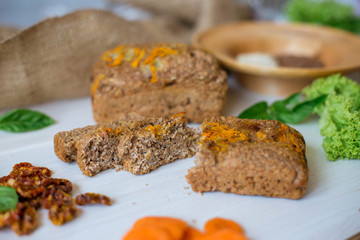 Dietary bread without yeast from whole grain flour. Healthy food, bread with vegetables and bran.