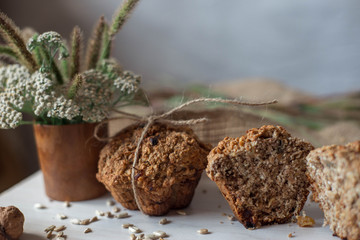 Whole wheat flour muffins. Sugar-free dessert, Healthy diet. Beautiful composition of flowers, ingredients and dessert