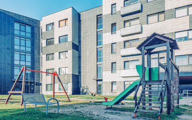 Fototapeta na wymiar EU New apartment residential buildings children playground