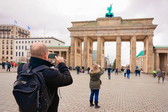 People taking photo of Brandenburg gate in Berlin