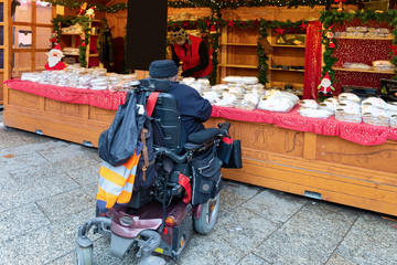 Disabled person on wheelchair at Christmas market in Germany