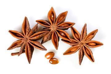 Star anise. Three star anise fruits with two seeds. Macro close up Isolated on white background...
