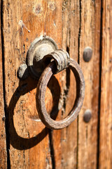 Vintage knocker on a wooden door