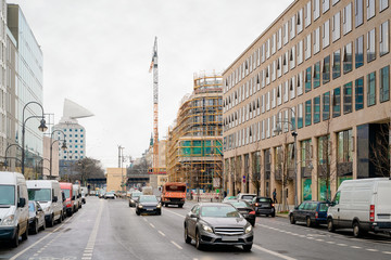 Fototapeta na wymiar Street with cars and building construction in road in Berlin