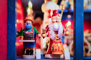 Fototapeten Wooden Christmas tree toys of Christmas market in Germany © Roman Babakin