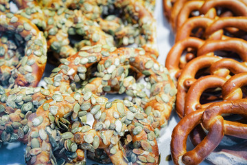 Pumpkin Bretzel baked pastry in Christmas market in Germany
