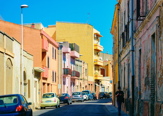 Fototapeta na wymiar Street view on Road with car parked in Cagliari