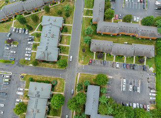 Aerial view over suburban homes and roads in a residential suburban district