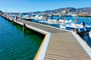 Old Sardinian Marina with ships on Mediterranean Sea in Villasimius