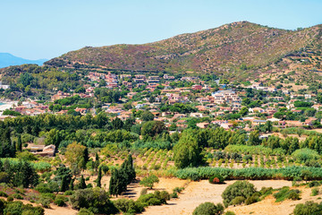 Fototapeta na wymiar Scenery with hills and houses in Cagliari in Sardinia