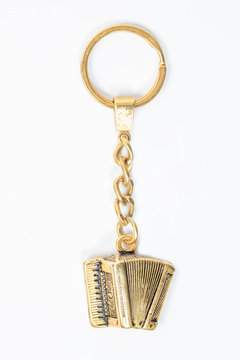 llavero de acordeon de oro o bronce de colombia
