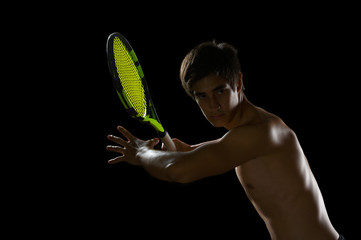 Young Tennis player ready to swing  a racquet