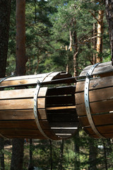 Empty barrels used for building route in rope park
