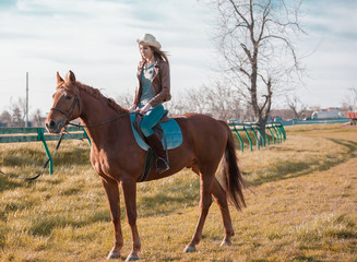 Woman sitting  horse. Day.
