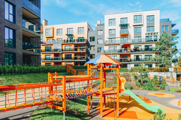 Fototapeta na wymiar Children playground at apartment residential buildings