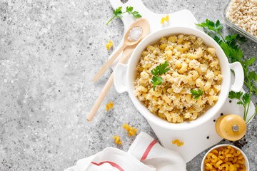 Makaroni po-flotski. Boiled pasta in navy-style with ground chicken meat and fried onions