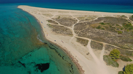 Aerial drone photo of iconic exotic sandy peninsula and sandy beach of Possidi with turquoise clear sea, Kassandra, Halkidiki, North Greece