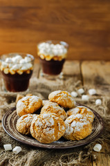 Pumpkin cookies with cups of coffee and marshmallow