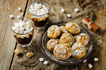 Pumpkin cookies with cups of coffee and marshmallow