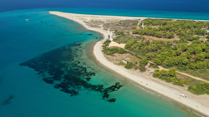 Fototapeta na wymiar Aerial drone photo of iconic exotic sandy peninsula and sandy beach of Possidi with turquoise clear sea, Kassandra, Halkidiki, North Greece