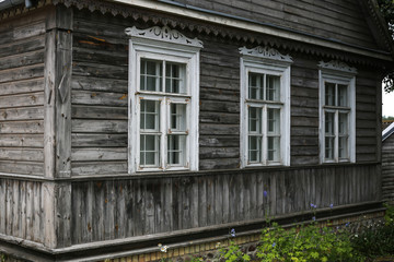 Fototapeta na wymiar Typical house in Lithuania, Trakai. Antique old house with grey old wood