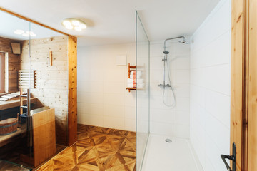 Interior of modern white bathroom with wood design sink shower