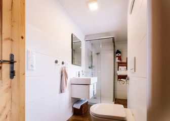 Interior of modern bathroom wood design toilet bowl sink shower