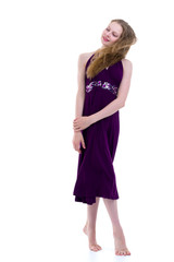 Little girl in a dress developing in the wind.